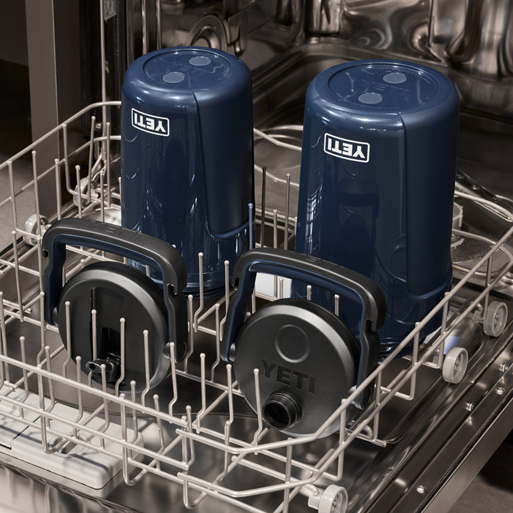 Two navy Yeti Silo Jugs in a dishwasher.