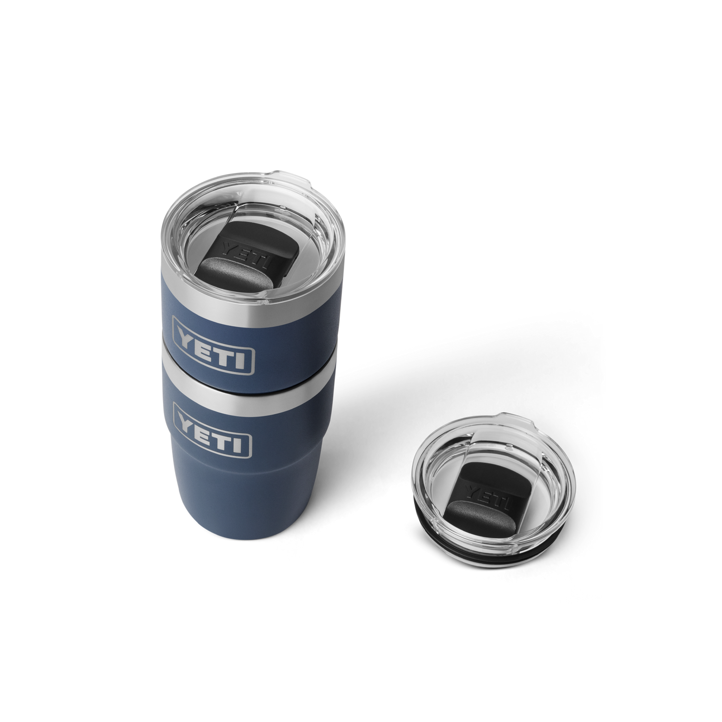 Blue YETI tumbler with clear lid on a white background