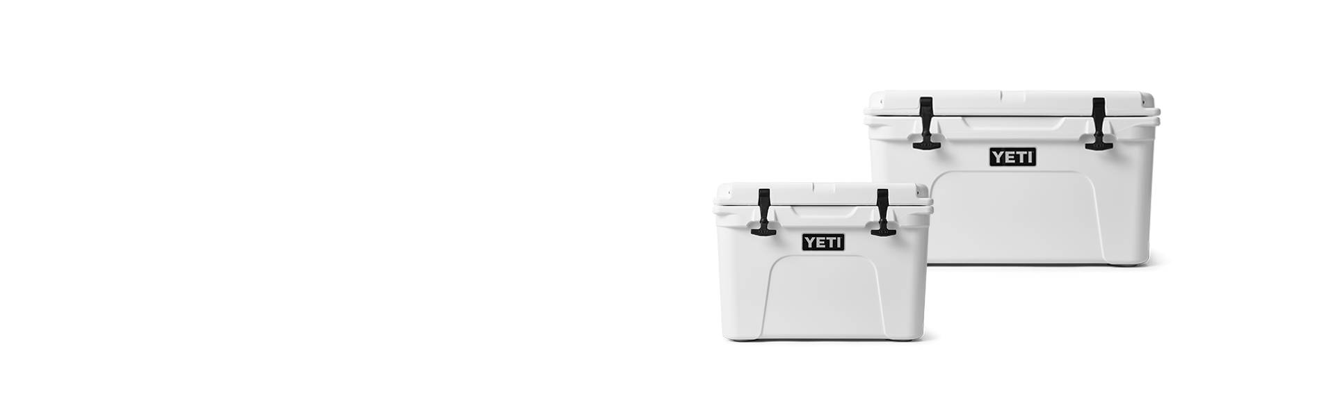 Two white YETI coolers on a white background